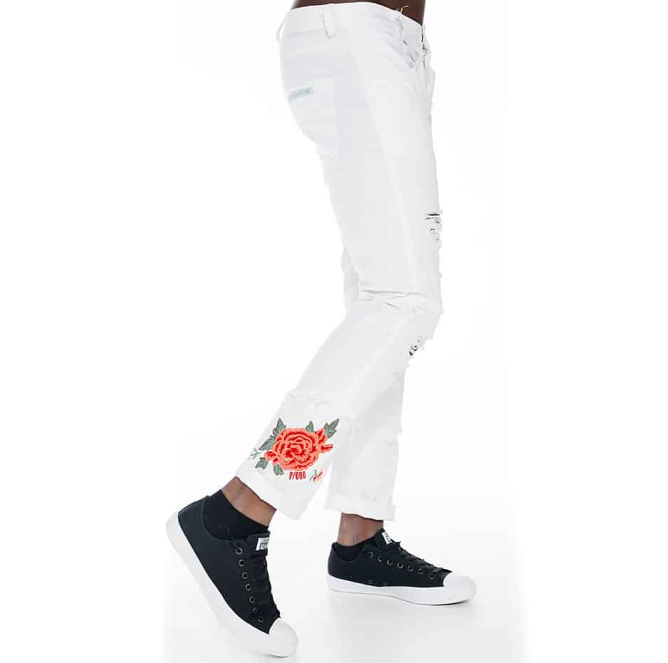 White slim fit pants with rose on hem